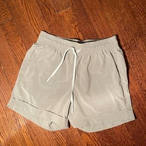 Size 4 lululemon shorts with cuffed bottoms and pocket detail in light green